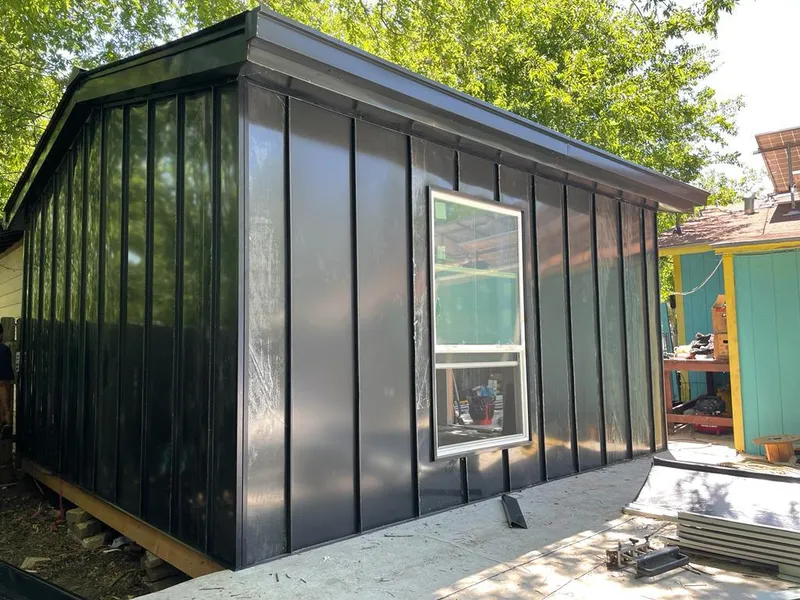 Black standing seam metal wall panels for Roof Inspection in Harlingen