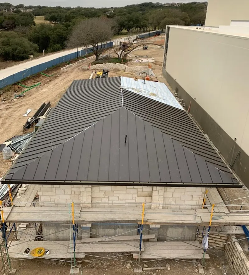 Metal roof new construction with scaffolding in Harlingen
