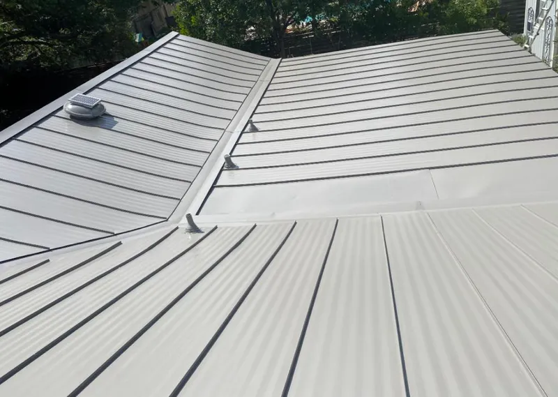 Solar attic fan installed on a metal roof for Roof Ventilation in Harlingen